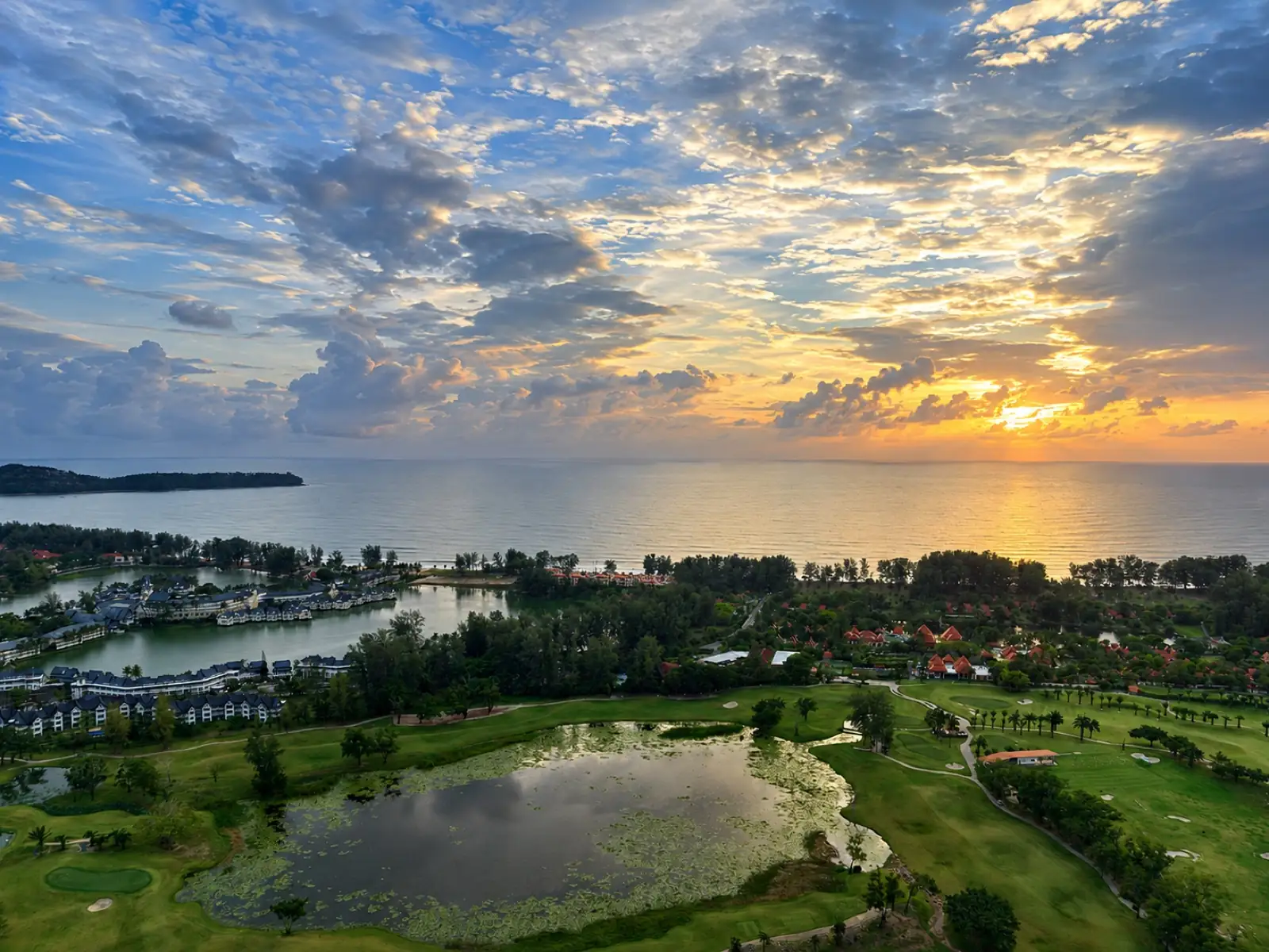 Bang Tao Laguna Phuket golf community aerial view with mountains